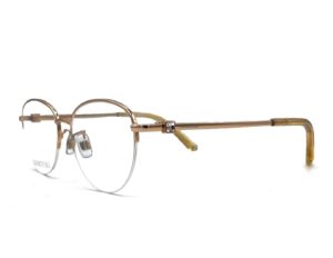 Swarovski 5418_d - occhiale da vista donna in metallo nylor asta in metallo Montatura dalla forma tonda leggermente ovalizzata con aste lavorate e impreziosite da cristalli swarovski.