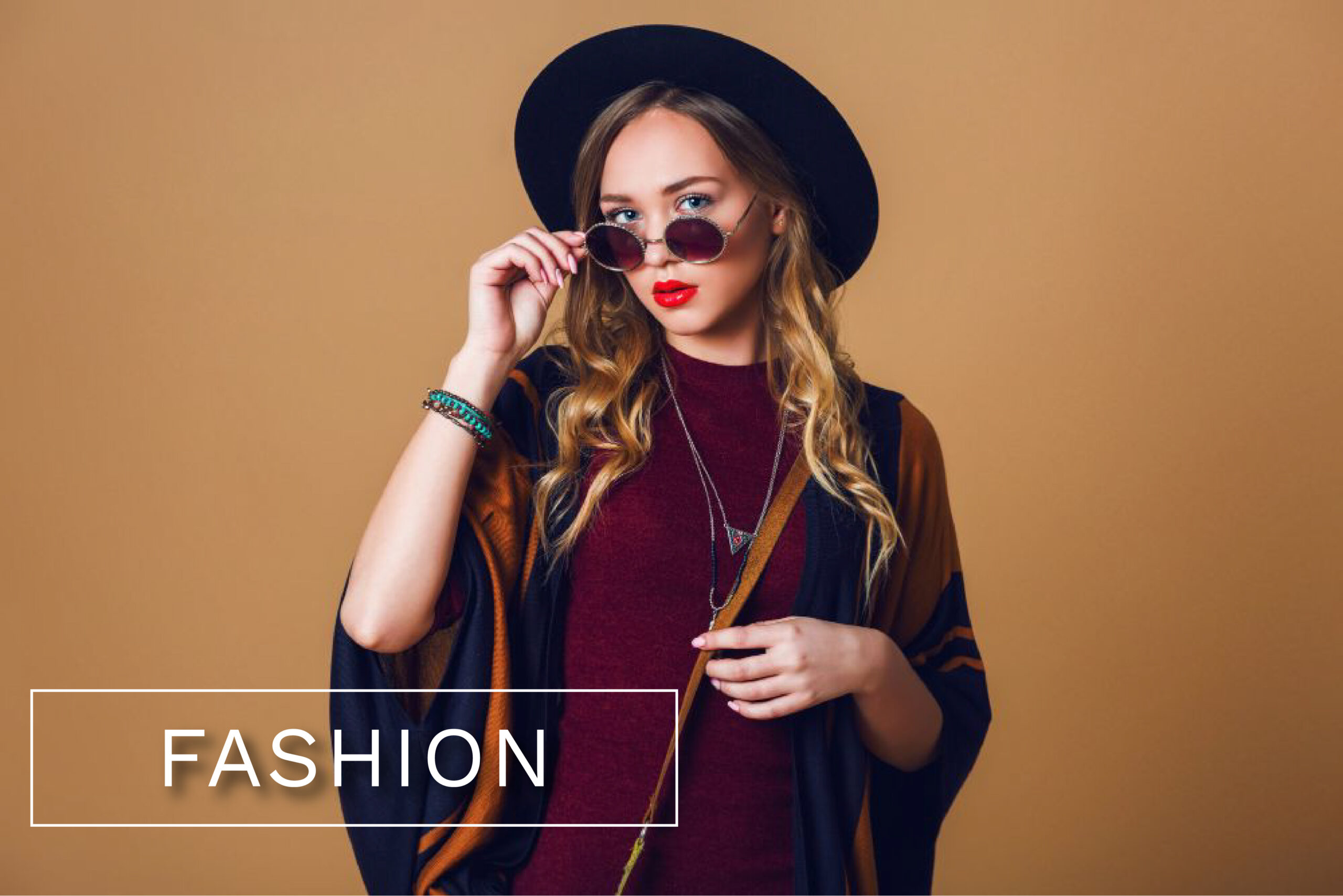 FASHION-studio-close-up-portrait-young-fresh-blonde-woman-brown-straw-poncho-wool-black-trendy-hat-round-glasses-looking-camera-green-leather-had