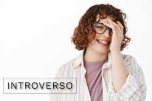 INTROVERSO-annoyed-adult-slavic-man-with-black-top-hat-wearing-sunglasses-keeping-hand-close-his-mouth-pointing-side